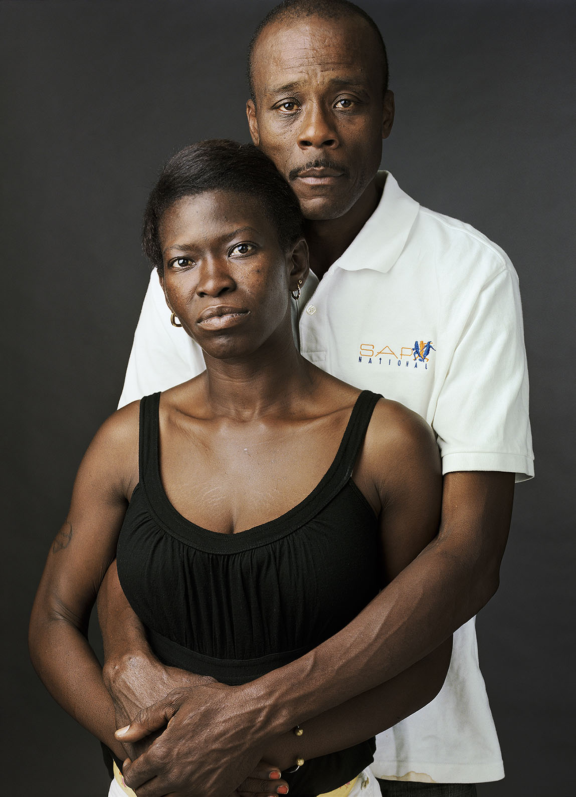 USA. "Down and Out in the South": Studio portraits of homeless people in Atlanta (GA), Columbia (SC) and the Mississippi Delta.  Sharlene (b. St. Catherine, Jamaica, 1976) and Elliot (b. 1Verona, Italy, 1960), photographed in Atlanta, GA. June 2011.