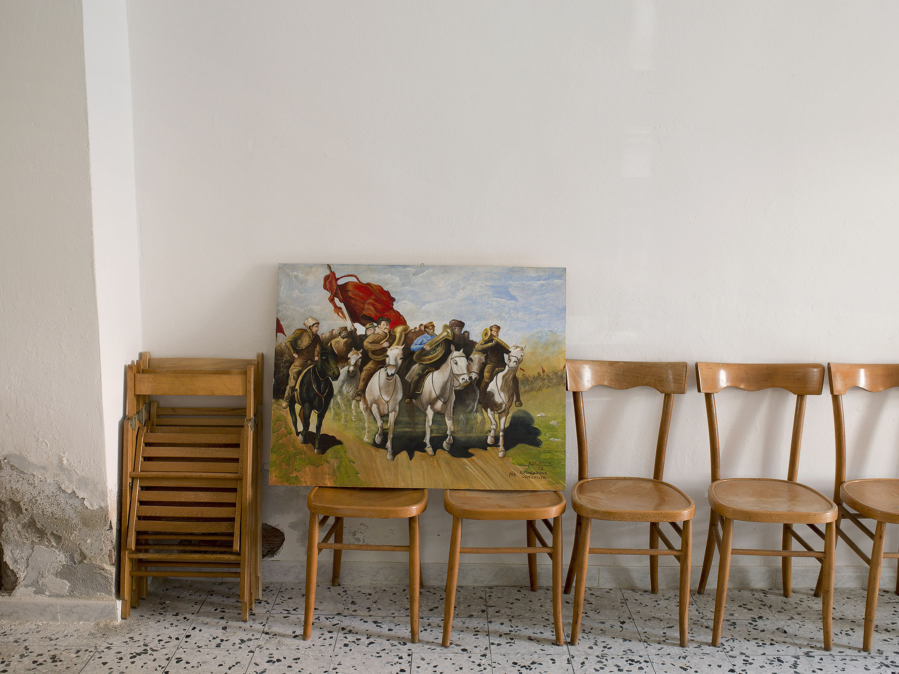 Communism, Italy. Partito della Rifondazione Comunista, aka PRC: Circolo Edda Fagni in Cecina, Toscana. The painting, La Carica, (The Charge) a scene from the Russian Revolution, is by Sergio Bertolini.