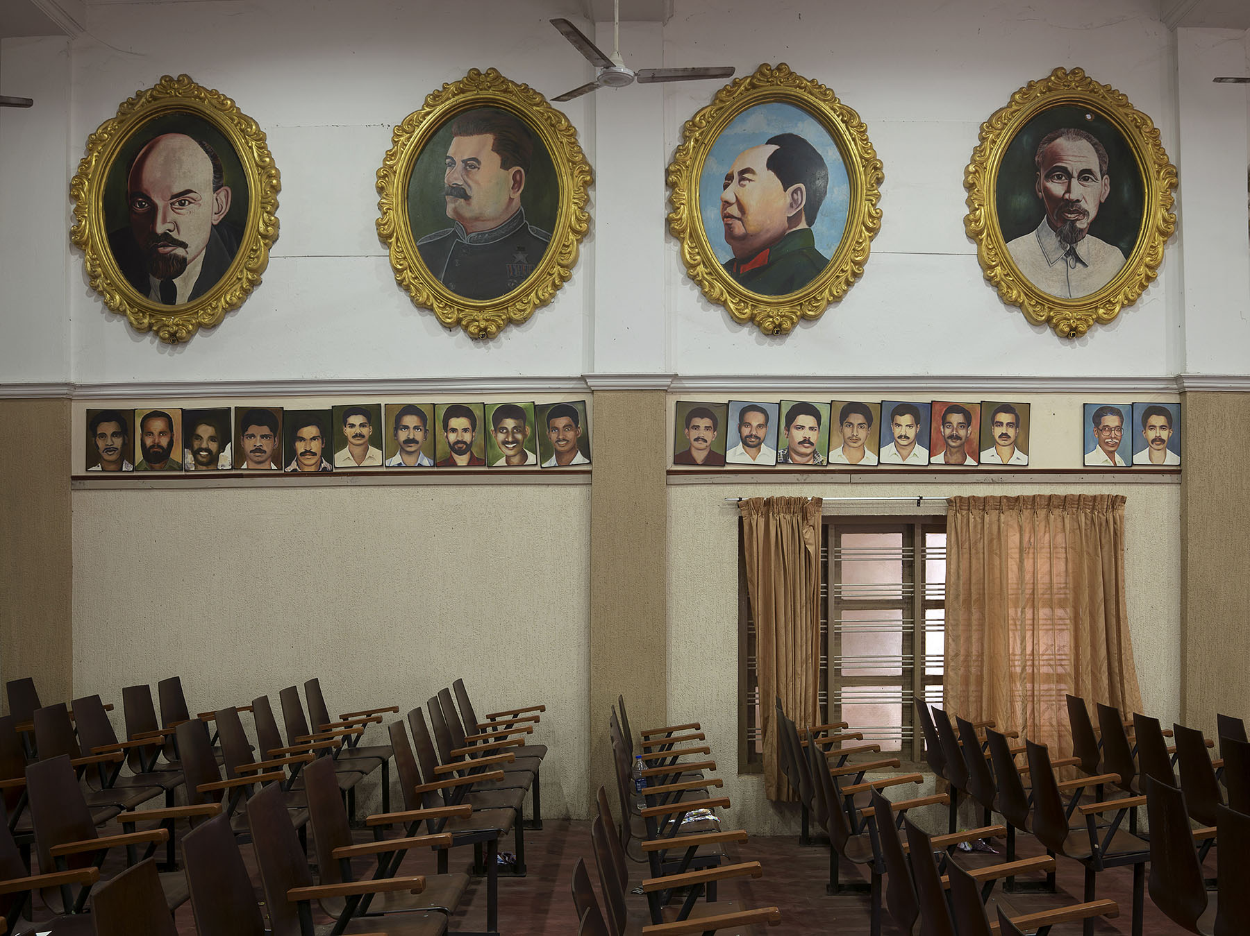 Communism in India - Kerala. Communist Party of India (Marxist), aka CPI (M): Kannur district committee office.
Meeting hall with portraits of local party activists beneath portraits of Lenin, Stalin, Mao and Ho Chi Minh.
Since the 2016 elections, CPI (M) has been the major political party in Kerala and the leading partner in the communist-led government of Kerala State.