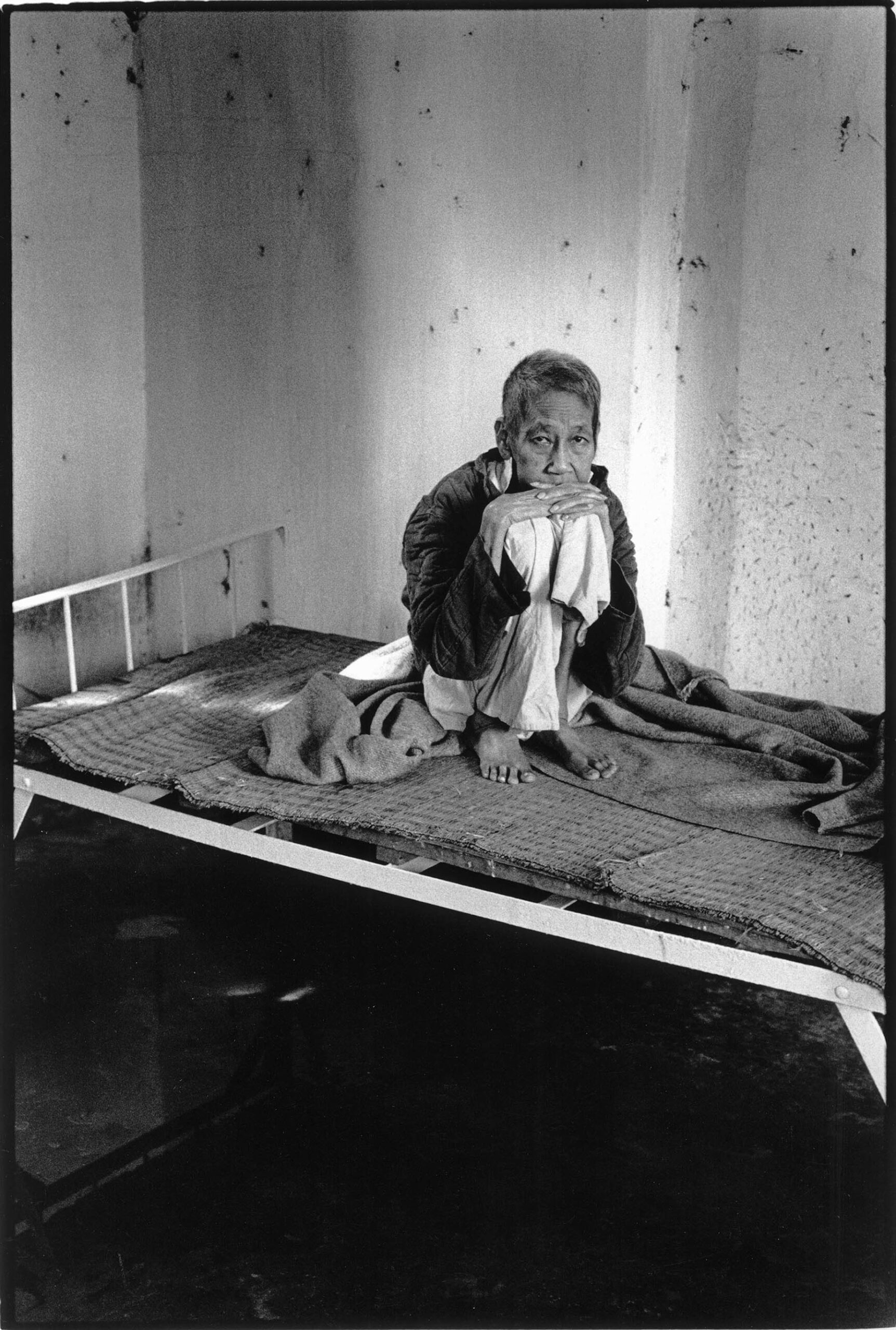 Vietnam, psychiatry and war.  Patient in her room at Central Mental Hospital near Hanoi. Part of the patients are suffering from war traumas.