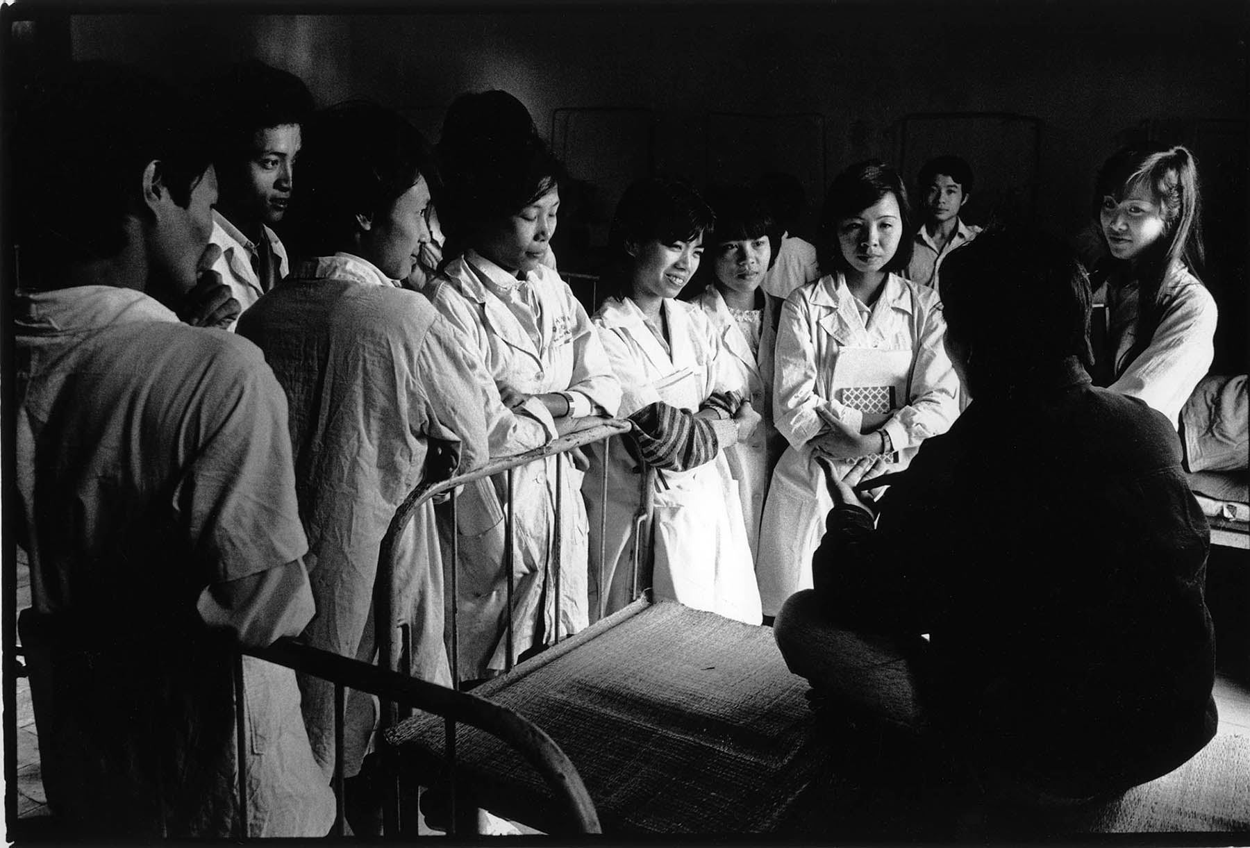 Vietnam, psychiatry and war. Medical students interview psychiatric patient with war trauma in the Bach Mai hospital in Hanoi.